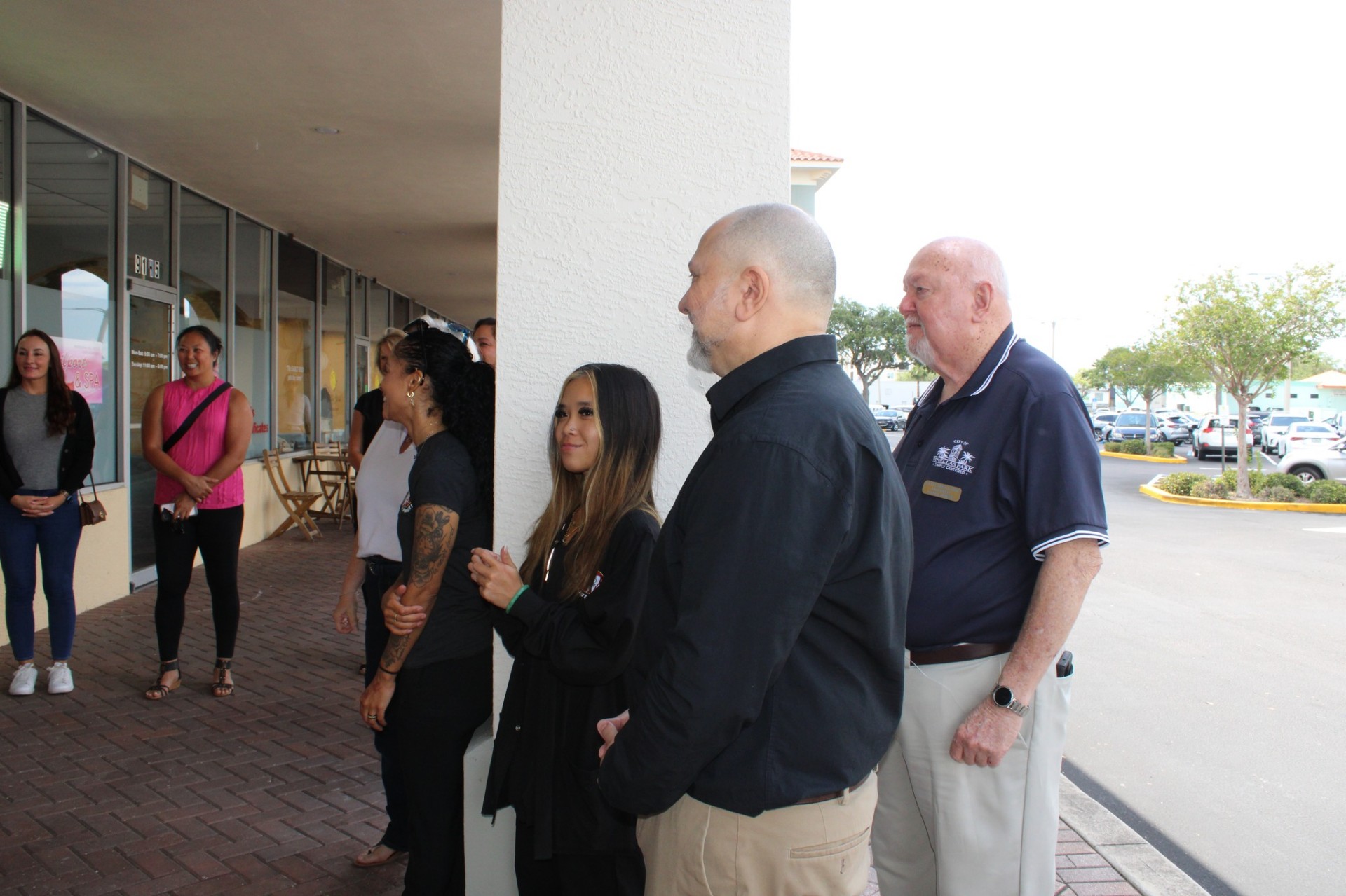 Team gathered along the sidewalk outside the Pinellas Park office