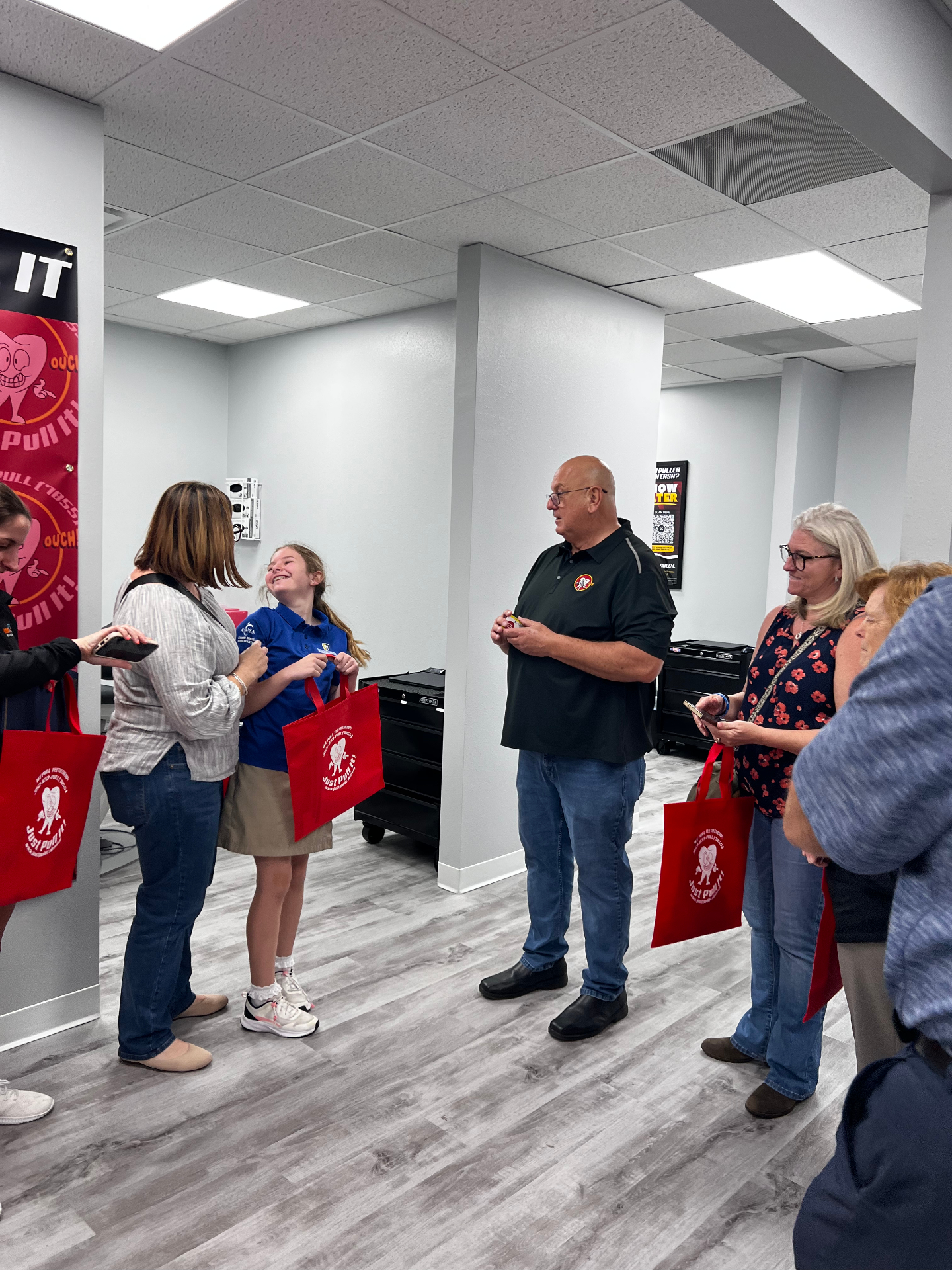 Family visiting the Brandon office on opening day