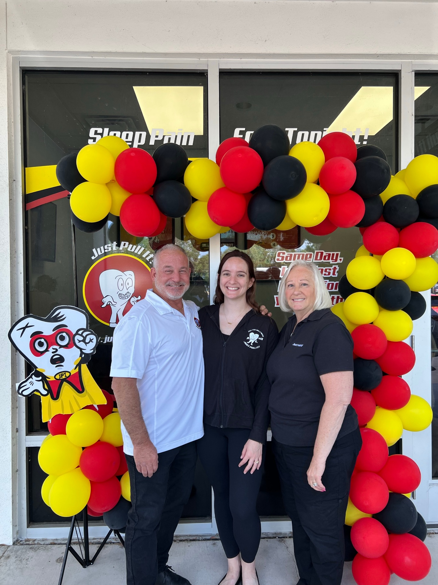 Dr. Jeffrey Hameroff with team members under the Lutz balloon arch