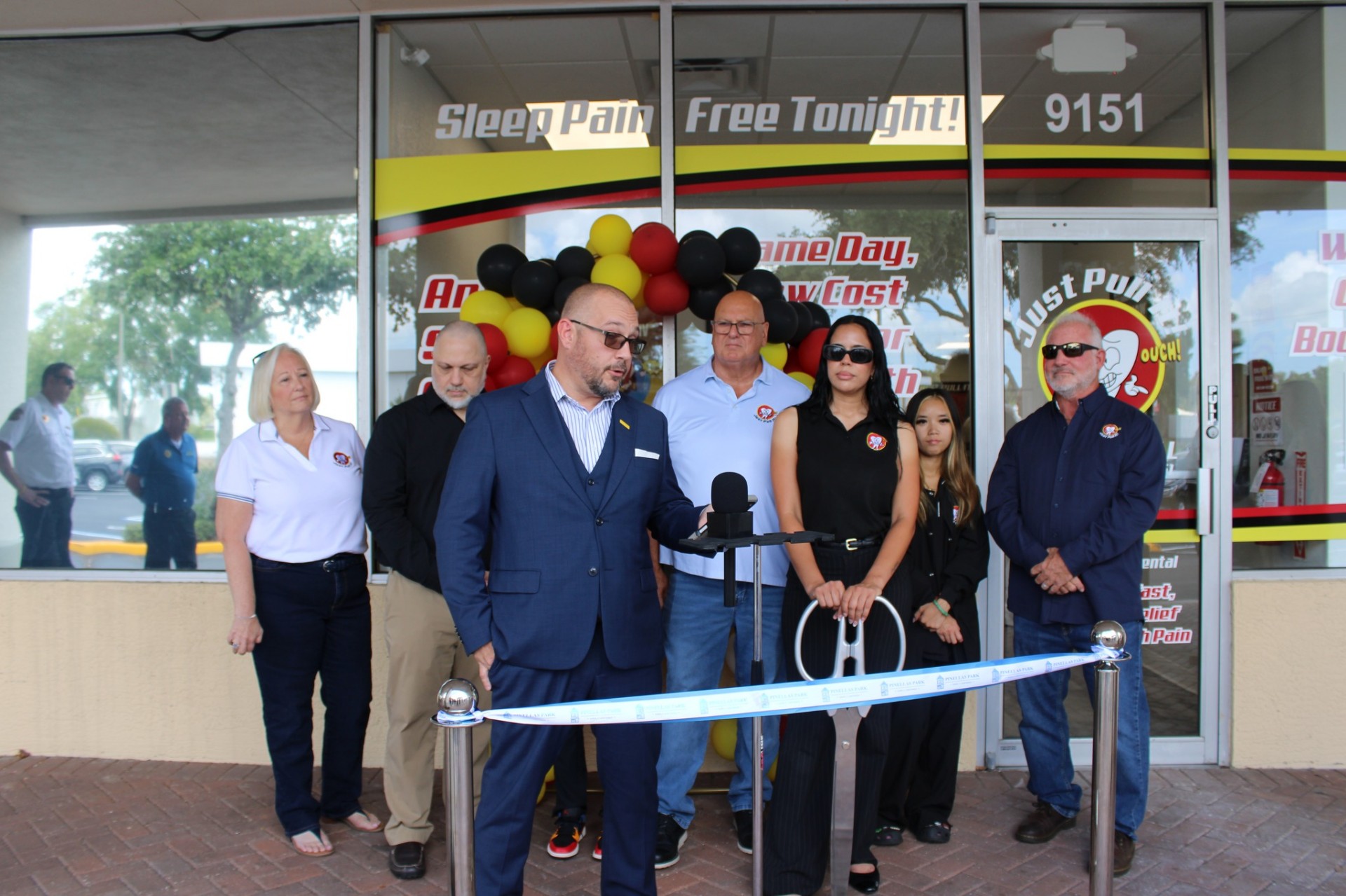 Speeches at the microphone before the Pinellas Park ribbon cutting