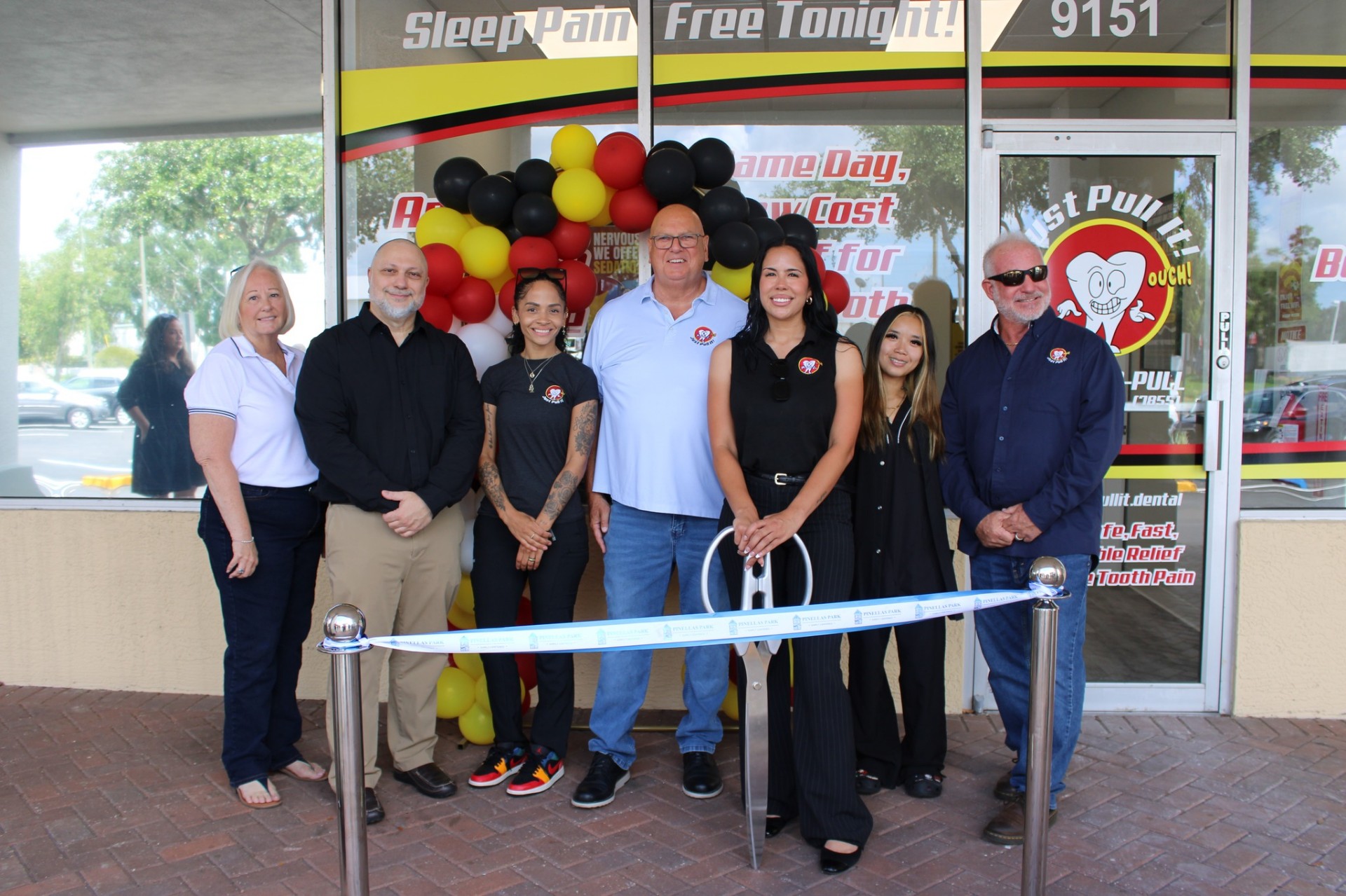 Just Pull It team lined up in front of the Pinellas Park office